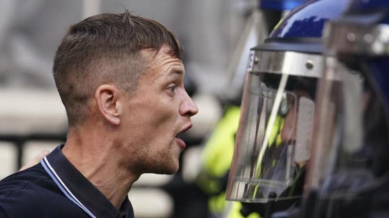 Protesters confronted police during a protest near Downing Street after a Southport stabbing attack. 