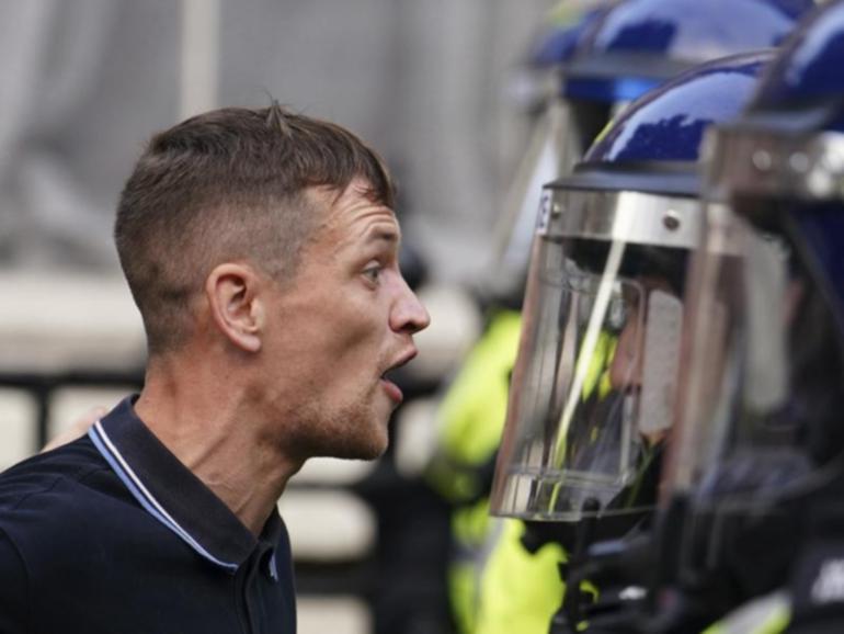 Protesters confronted police during a protest near Downing Street after a Southport stabbing attack. 