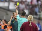 Australia coach Tony Gustvasson  is shown a yellow card by French referee Francois Letexier during the loss to the USA  overnight.