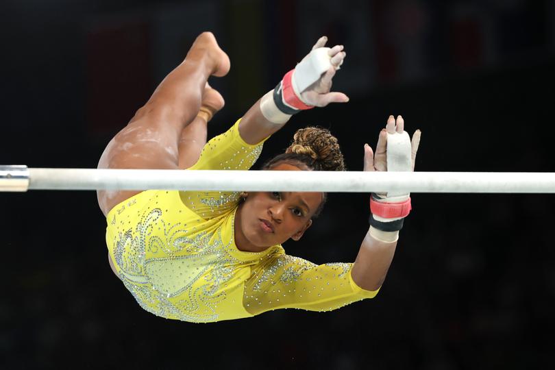 PARIS, FRANCE - AUGUST 01: Rebeca Andrade of Team Brazil competes on the uneven bars during the Artistic Gymnastics Women's All-Around Final on day six of the Olympic Games Paris 2024 at Bercy Arena on August 01, 2024 in Paris, France. (Photo by Jamie Squire/Getty Images)