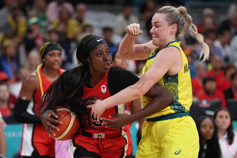 LILLE, FRANCE - AUGUST 01: Laeticia Amihere #15 of Team Canada handles the ball during the Women's Group Phase - Group B match between Team Australia and Team Canada on day six of the Olympic Games Paris 2024 at Stade Pierre Mauroy on August 01, 2024 in Lille, France. (Photo by Gregory Shamus/Getty Images)