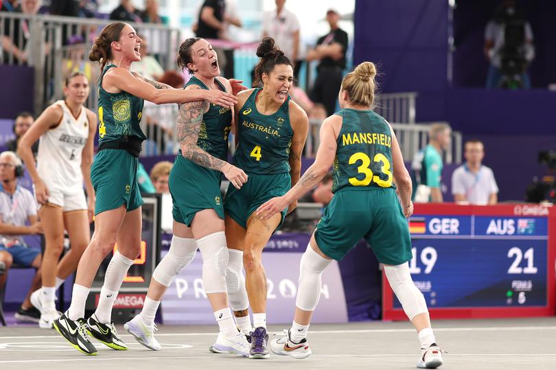 Alex Wilson #4 of Team Australia reacts with teammates.