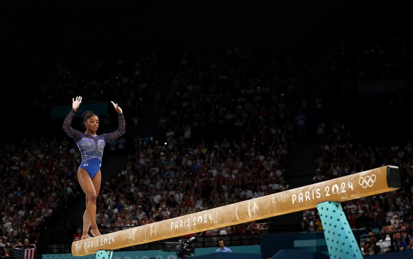 PARIS, FRANCE - AUGUST 01: Simone Biles of Team United States competes on the balance beam during the Artistic Gymnastics Women's All-Around Final on day six of the Olympic Games Paris 2024 at Bercy Arena on August 01, 2024 in Paris, France. (Photo by Jamie Squire/Getty Images)