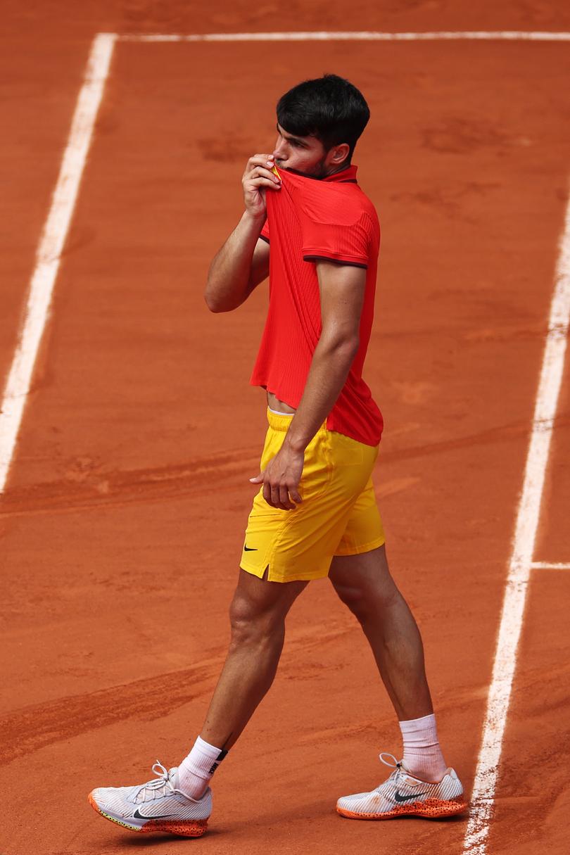 PARIS, FRANCE - AUGUST 01: Carlos Alcaraz of Team Spain reacts after winning match point against Tommy Paul of Team United States during the Men's Singles Quarter-final match on day six of the Olympic Games Paris 2024 at Roland Garros on August 01, 2024 in Paris, France. (Photo by Matthew Stockman/Getty Images)