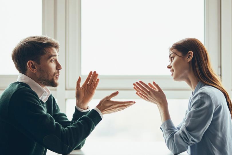 A man and woman debating.