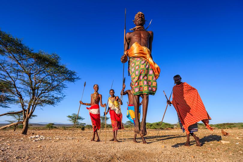 African warrior from Samburu tribe performing a traditional jumping dance, central Kenya. Samburu tribe is one of the biggest tribes of north-central Kenya, and they are related to the Maasai. Bartosz Hadyniak