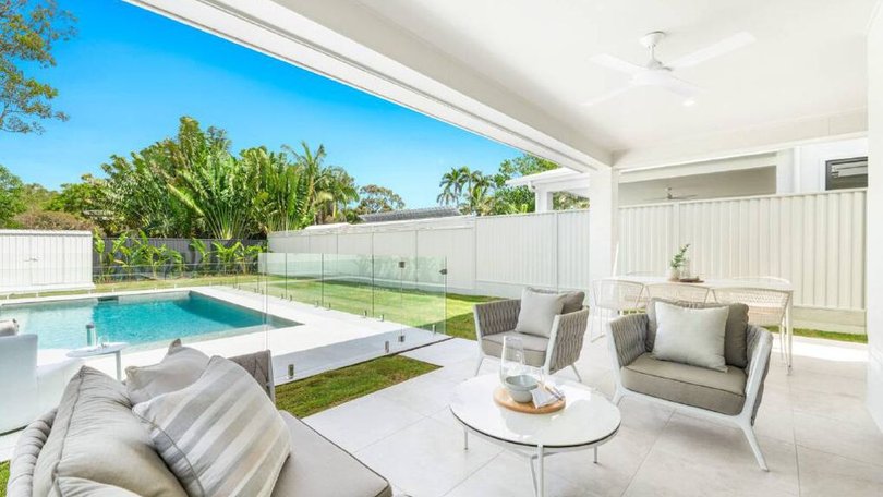 The alfresco area overlooks the pool.