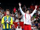  Kyle Chalmers watches on as Pan Zhanle is awarded gold.