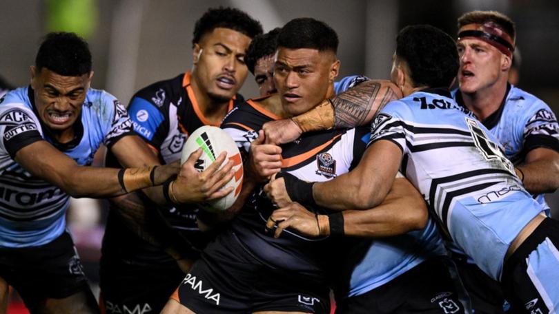 Wests Tigers prop Stefano Utoikamanu has joined the NRL ladder leaders from the cellar dwellars. (Dan Himbrechts/AAP PHOTOS)