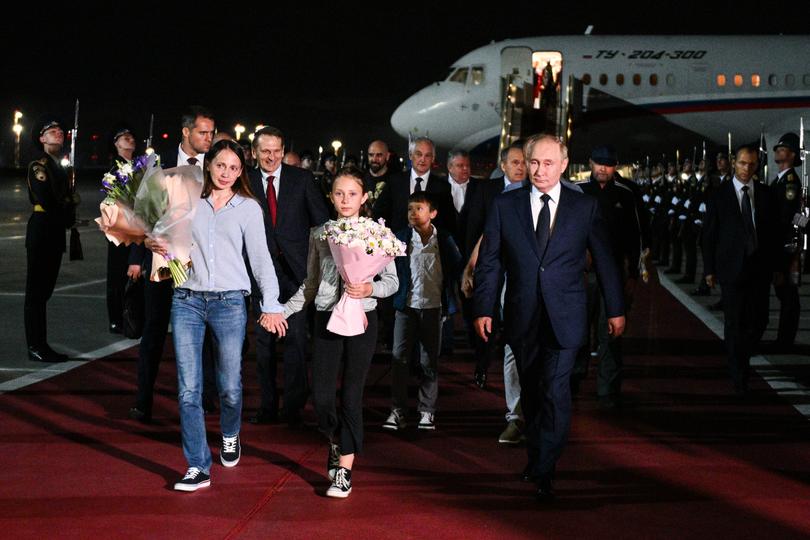 RUSSIA, MOSCOW - AUGUST 1, 2024: Russia's President Vladimir Putin (R) welcomes Russian citizens released in a prisoner exchange, including two minors Artyom Dultsev, and Anna Dultseva.