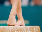 The American Sunisa Lee, a gymnast whose joints are under constant strain, practices on the beam at the Olympics in Paris, July 28, 2024. With years of fractures, surgeries, hardware and pain, Olympians can list their injuries as readily as their achievements. (Gabriela Bhaskar/The New York Times)