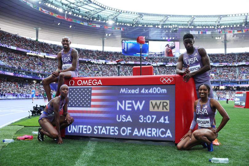 PARIS, FRANCE - AUGUST 02: Vernon Norwood, Shamier Little, Kaylyn Brown and Bryce Deadmon of Team United States celebrate after breaking the world record during the 4 x 400m Relay Mixed Round 1 on day seven of the Olympic Games Paris 2024 at Stade de France on August 02, 2024 in Paris, France. (Photo by Michael Steele/Getty Images)