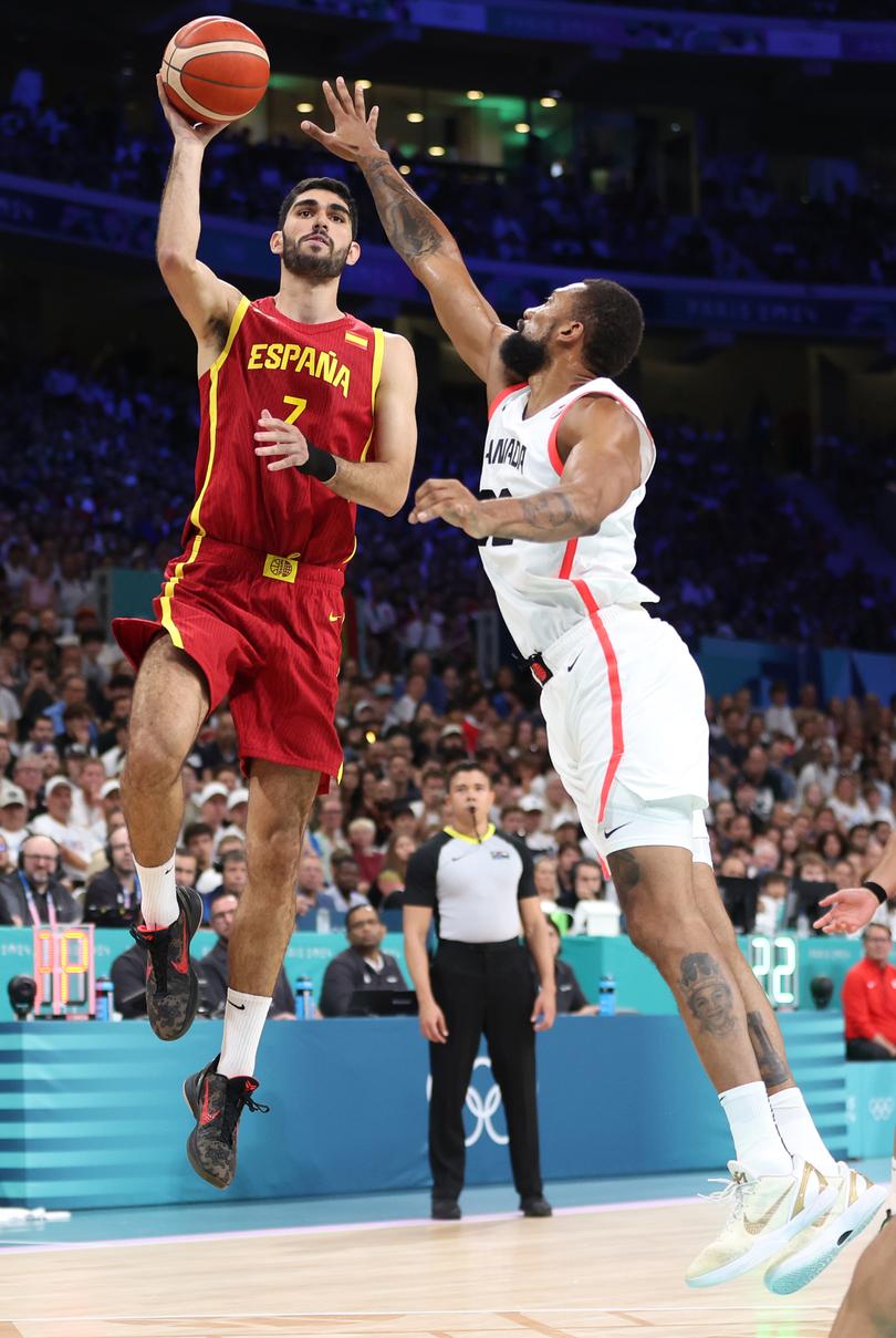 LILLE, FRANCE - AUGUST 02: Santi Aldama #7 of Team Spain shoots over Khem Birch #92 of Team Canada during the Men's Group Phase - Group A game between Team Canada and Team Spain on day seven of the Olympic Games Paris 2024 at Stade Pierre Mauroy on August 02, 2024 in Lille, France. (Photo by Gregory Shamus/Getty Images)