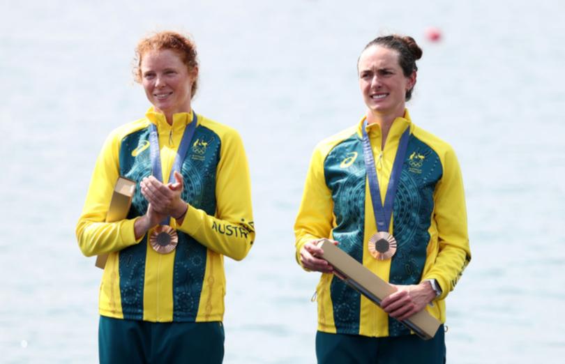 PARIS, FRANCE - AUGUST 02: Bronze medalists Jess Morrison and Annabelle McIntyre of Team Australia celebrate on the podium at the Rowing Women's Pair medal ceremony on day seven of the Olympic Games Paris 2024 at Vaires-Sur-Marne Nautical Stadium on August 02, 2024 in Paris, France. (Photo by Alex Davidson/Getty Images)