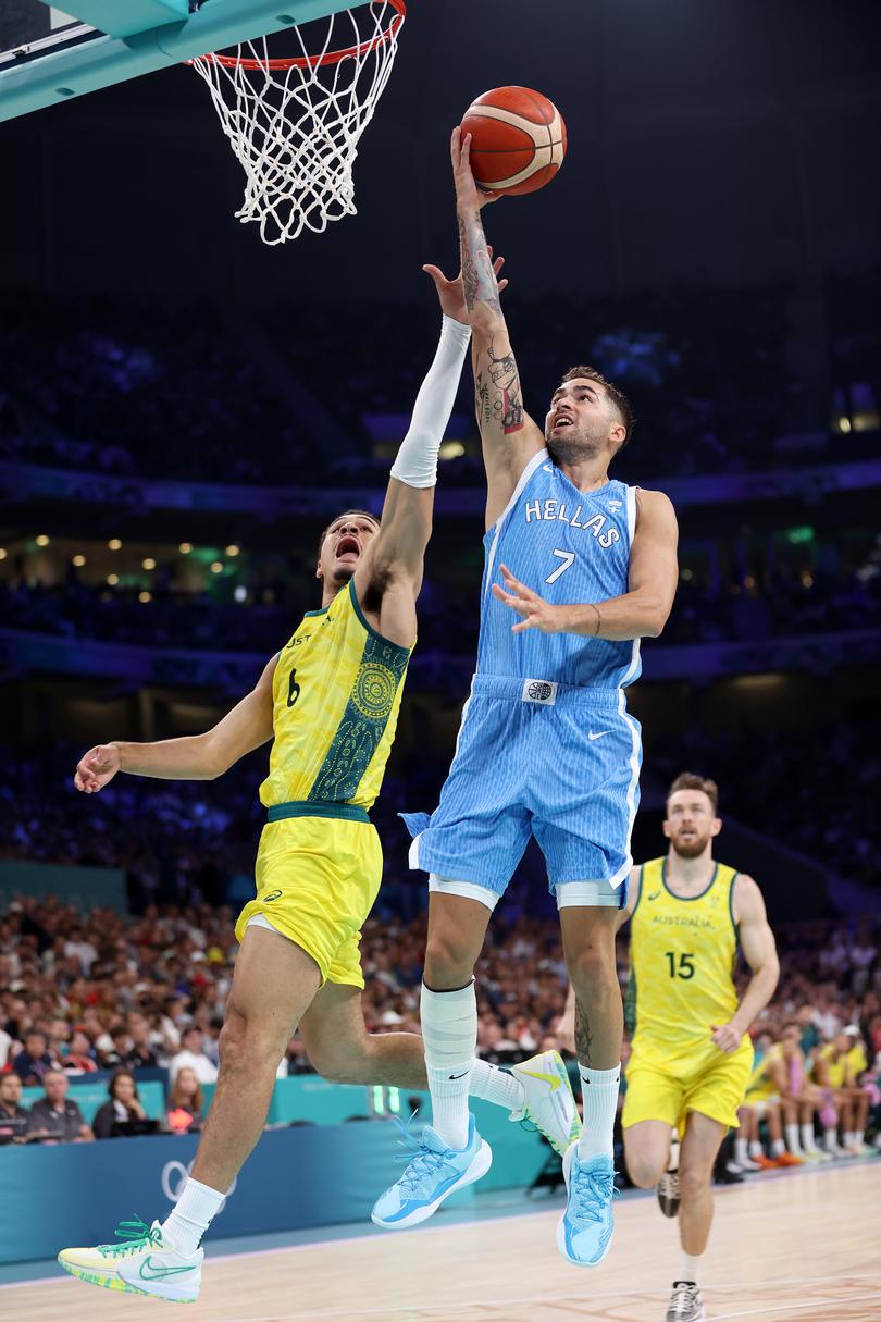 LILLE, FRANCE - AUGUST 02: Vasileios Toliopoulos #7 of Team Greece drives to the basket against Josh Green #6 of Team Australia  during the Men's Group Phase - Group A match between Team Australia and Team Greece on day seven of the Olympic Games Paris 2024 at Stade Pierre Mauroy on August 02, 2024 in Lille, France. (Photo by Gregory Shamus/Getty Images)