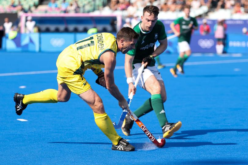 PARIS, FRANCE - JULY 29: Eddie Ockenden of Team Australia is challenged by Jeremy Duncan of Team Ireland during the Men's Pool B match between Ireland and Australia on day three of the Olympic Games Paris 2024 at Stade Yves Du Manoir on July 29, 2024 in Paris, France. (Photo by Lintao Zhang/Getty Images)