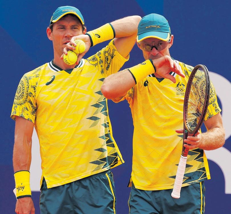 PARIS, FRANCE - JULY 31: John Peers of Team Australia looks on with partner Matthew Ebden of Team Australia against Dominik Koepfer of Team Germany and Jan-Lennard Struff of Team Germany during the Men's Doubles Quarter-final match on day five of the Olympic Games Paris 2024 at Roland Garros on July 31, 2024 in Paris, France. (Photo by Julian Finney/Getty Images)