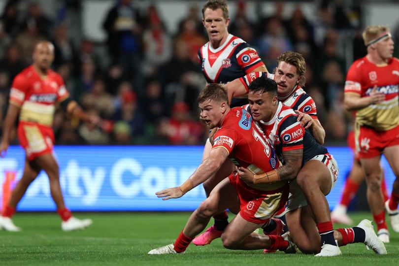 PERTH, AUSTRALIA - AUGUST 02: Tevita Pangai Junior of the Dolphins is tackled during the round 22 NRL match between Dolphins and Sydney Roosters at HBF Park, on August 02, 2024, in Perth, Australia. (Photo by Janelle St Pierre/Getty Images)