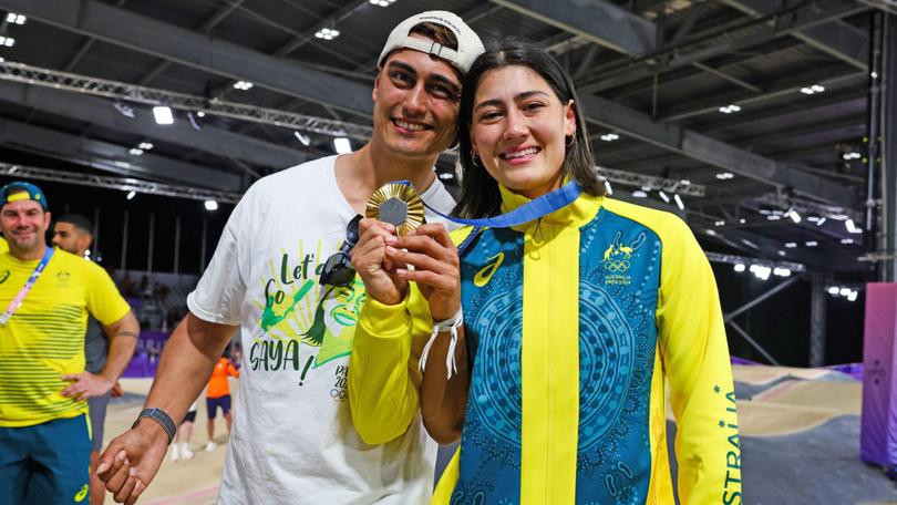  Saya Sakakibara with her brother Kai celebrating an emotional gold medal in the women's BMX racing. Inset,Gymnastics great Simone Biles.