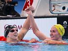 Katie Ledecky and Ariarne Titmus embrace after their 800m final.