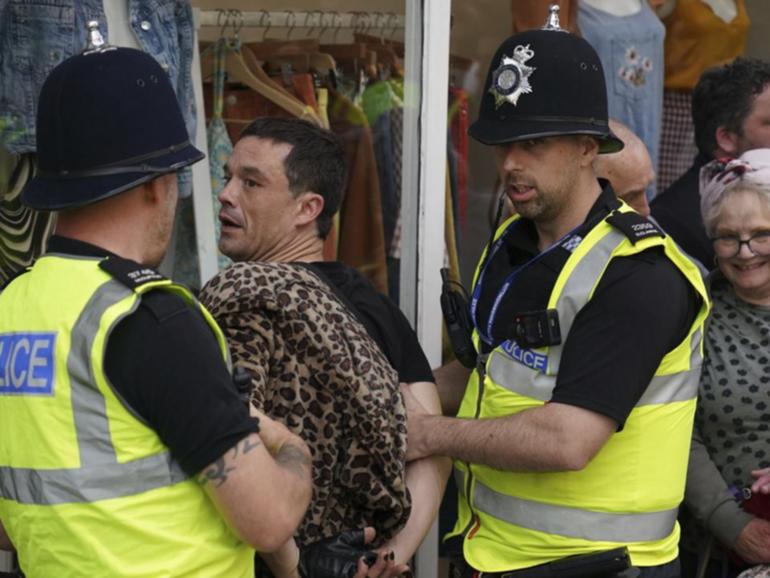 Police in Nottingham and other cities have detained people following unrest in the streets. (AP PHOTO)