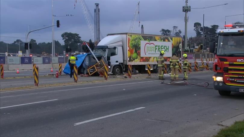 It’s believed the fruit truck ran through a red light before crashing into the van.