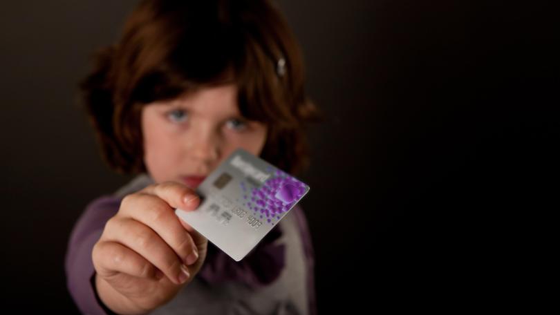 Cash or a debit card? In an increasingly cashless society, which is best to help parents teach their children about money and how to manage their finances?