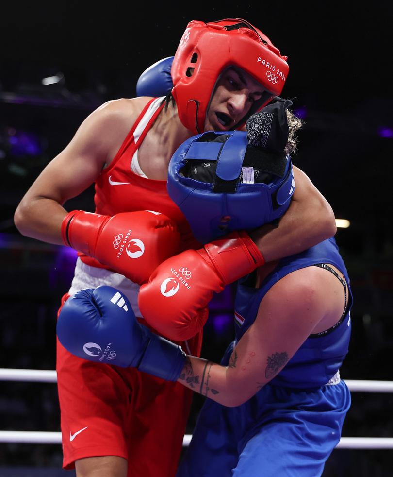 PARIS, FRANCE - AUGUST 03: Imane Khelif of Team Algeria holds Anna Luca Hamori of Team Hungary during the Women's 66kg Quarter-final round match on day eight of the Olympic Games Paris 2024 at North Paris Arena on August 03, 2024 in Paris, France. (Photo by Richard Pelham/Getty Images)