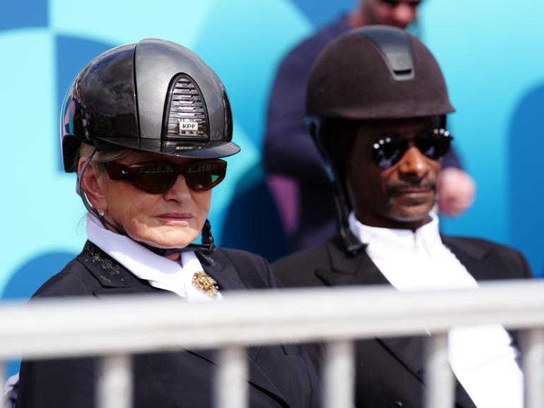 Snoop Dogg and Martha Stewart watching the Dressage Team Grand Prix Special at the Chateau de Versailles at the Paris Olympics.