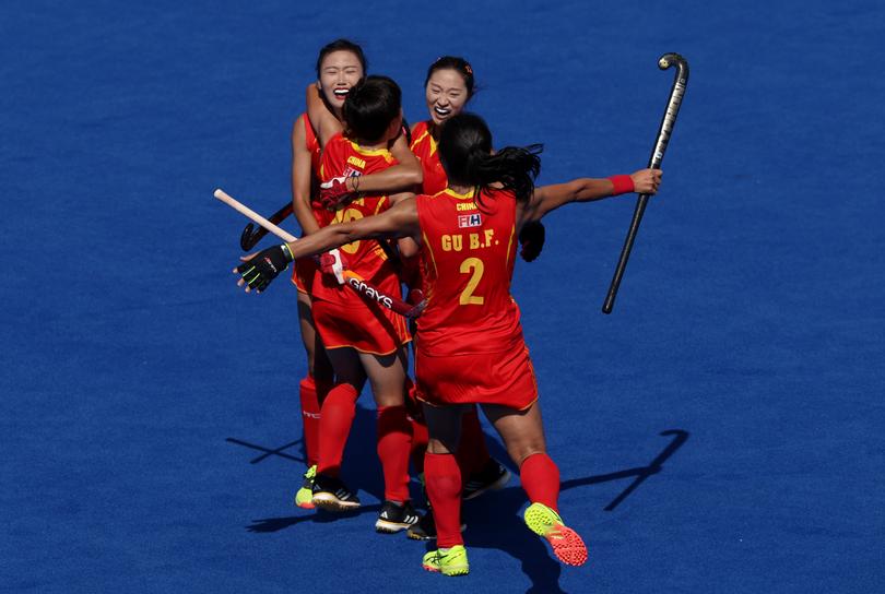 Team People's Republic of China celebrate victory.