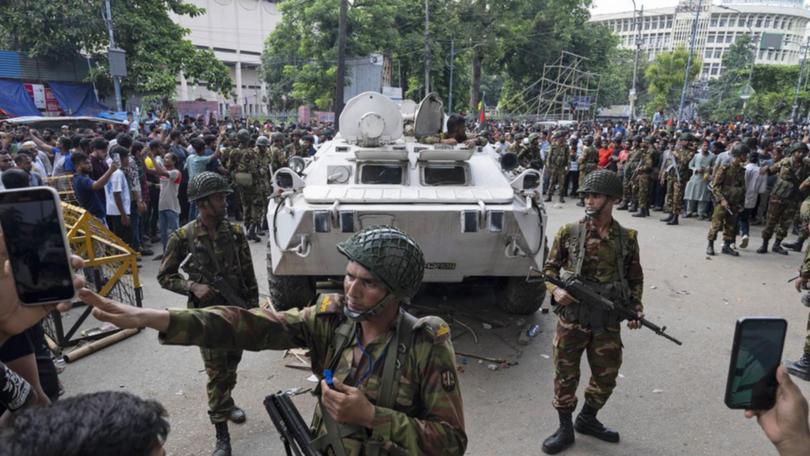 Bangladesh's army chief urged an end to violence and said an interim government would be formed. (AP PHOTO)