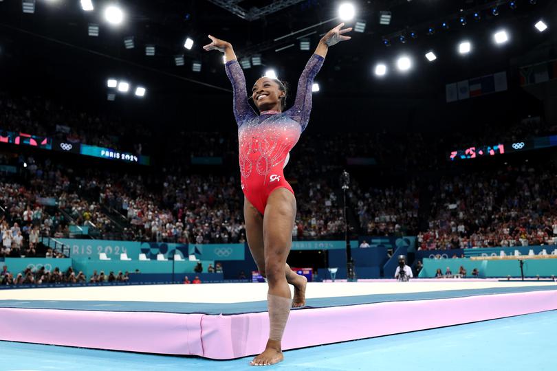 Biles held her salute for a comically long time as she stepped off the mat.