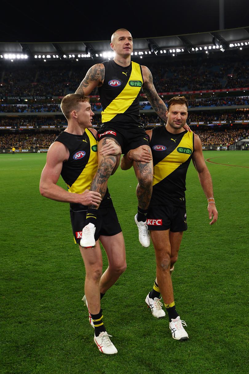 MELBOURNE, AUSTRALIA - JUNE 15: Dustin Martin of the Tigers is carried from the ground following his 300th match the round 14 AFL match between Richmond Tigers and Hawthorn Hawks at Melbourne Cricket Ground on June 15, 2024 in Melbourne, Australia. (Photo by Graham Denholm/Getty Images)