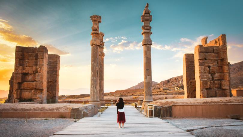 A tourist explores the ancient city of Persepolis in south Iran.