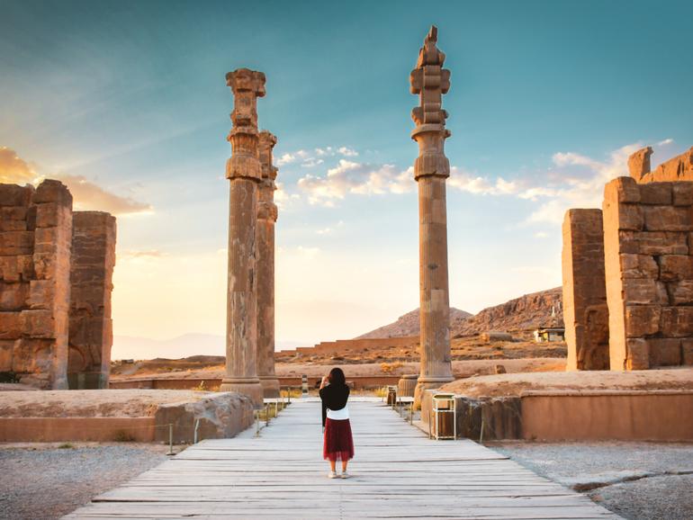 A tourist explores the ancient city of Persepolis in south Iran. 