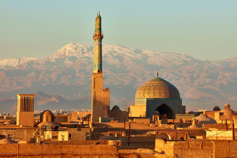 Ancient city of Yazd in sunrise lights in Iran.