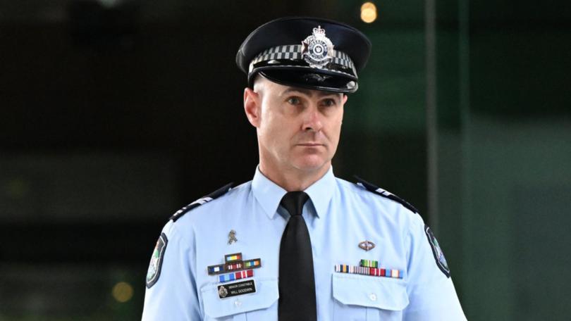 Senior Constable Will Goodwin told the Trains through a loud hailer to put their weapons down. (Darren England/AAP PHOTOS)