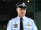 Senior Constable Will Goodwin told the Trains through a loud hailer to put their weapons down. (Darren England/AAP PHOTOS)