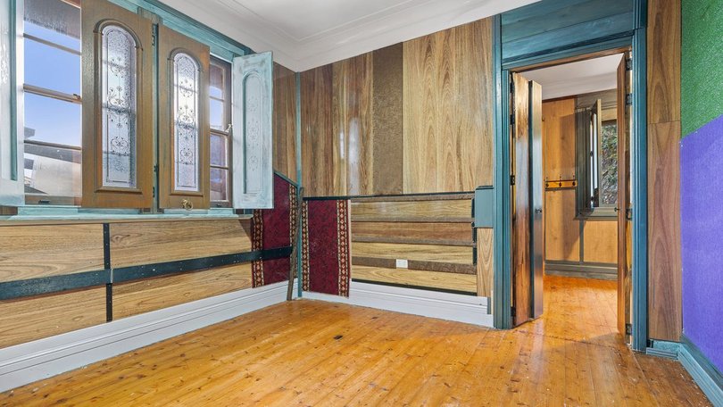 Upcycled doors are repurposed as shutters in one of the bedrooms.