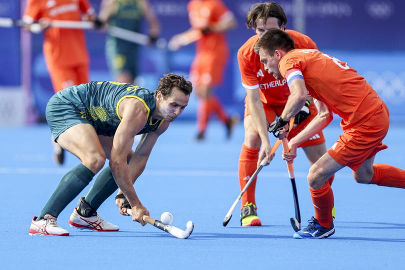 Thomas Craig of Australia and Thierry Brinkman of the Netherlands battle for the ball during the Hockey Men's Quarter-Final match between Netherlands and Australia.