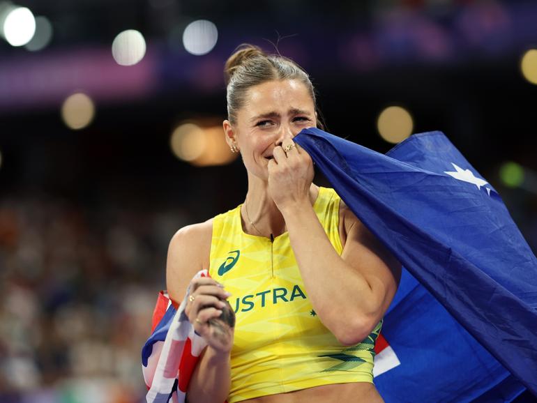 Nina Kennedy celebrates winning the women’s pole vault gold medal. 