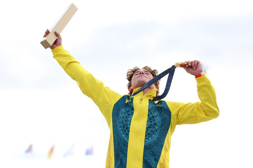 Gold medalist Keegan Palmer of Team Australia celebrates on the podium.