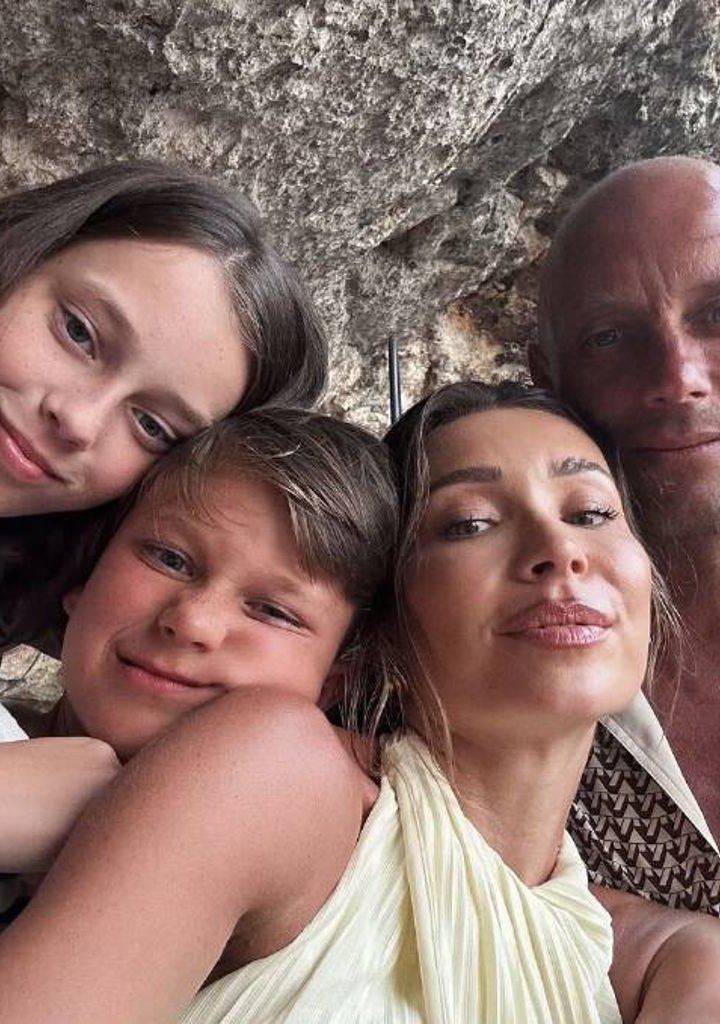 The couple on holiday in Europe last month with their two children.