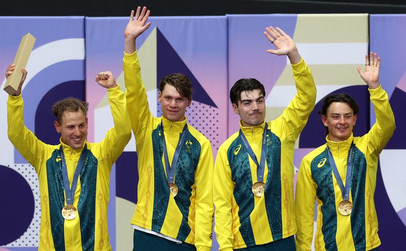 PARIS, FRANCE - AUGUST 07: Gold medalists Oliver Bleddyn, Sam Welsford, Conor Leahy, Kelland O'Brien of Team Australia pose on the podium the after the Men's Team Pursuit Finals on day twelve of the Olympic Games Paris 2024 at Saint-Quentin-en-Yvelines Velodrome on August 07, 2024 in Paris, France. (Photo by Alex Broadway/Getty Images)