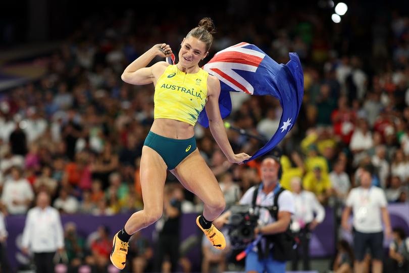 Nina Kennedy of Team Australia celebrates winning the gold medal after competing in the Women's Pole Vault Final on day twelve of the Olympic Games in Paris. 