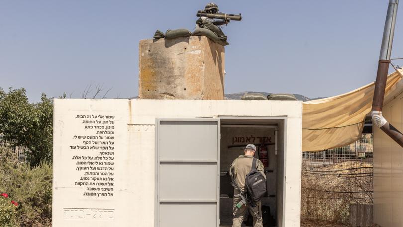 A soldier enters a shelter near the Israel border with Lebanon, in Snir, Israel, on July 16, 2024. As tensions again escalate with Hezbollah, Israelis face the prospect of another “lost year” in the evacuated north. (Avishag Shaar-Yashuv/The New York Times)