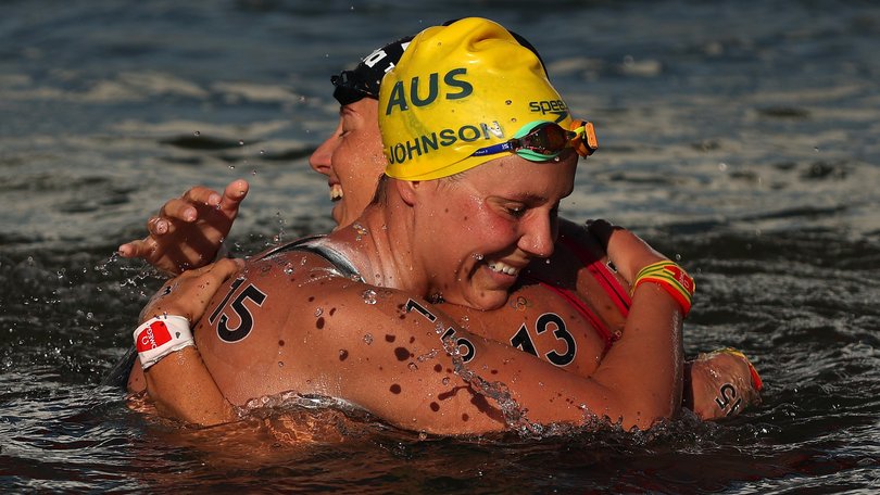 Moesha Johnson of Team Australia and Ginevra Taddeucci of Team Italy celebrate after winning silver and bronze in the Marathon Swim.