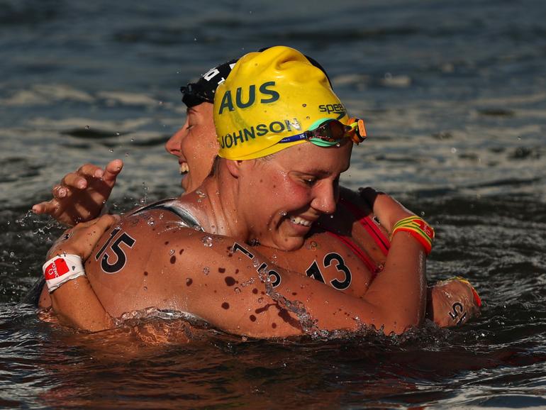 Moesha Johnson of Team Australia and Ginevra Taddeucci of Team Italy celebrate after winning silver and bronze in the Marathon Swim.