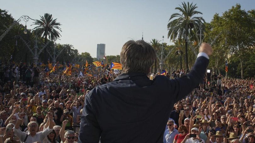 Catalan independence leader Carles Puigdemont addressed a Barcelona rally before disappearing.