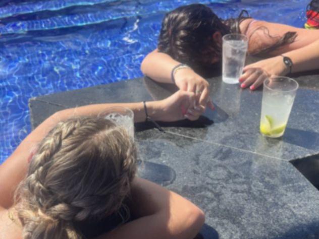 Zara Hull and Kaylie Pitzer collapsed in the pool in a Cancun resort after a sip of spiked water that sent Hull to the ICU.